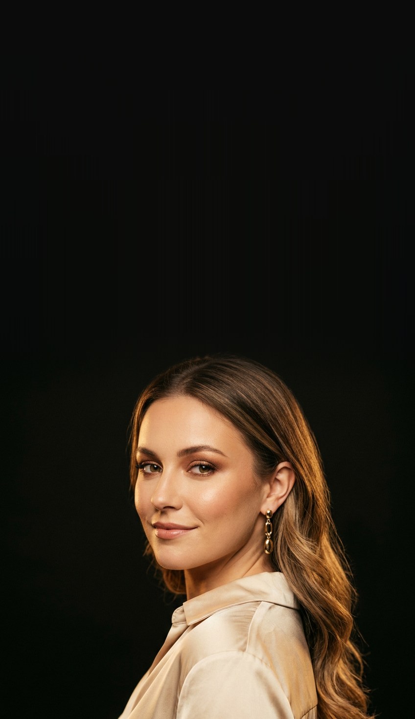 A creator in a champagne silk blouse